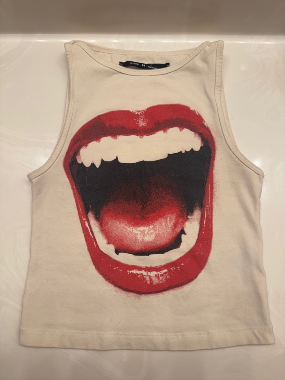 silence + noise cream tank top with open mouth design
